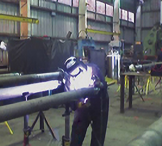 Photo of employee welding