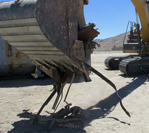 Photo of employees performing a metal inspection